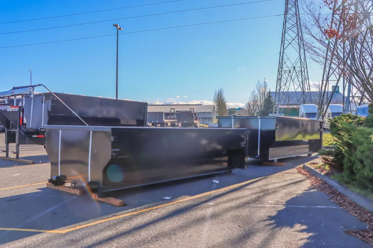 Roll-off dumpster ready for waste disposal at job site for Yard Waste Dumpster Rental in Woodland